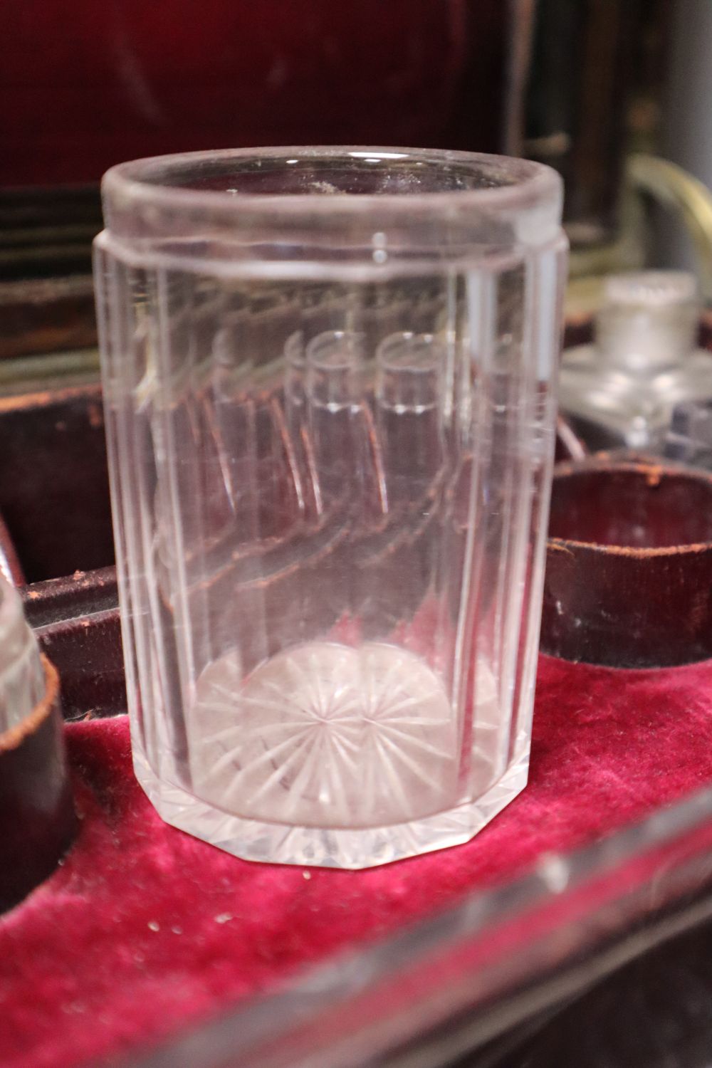 A Regency brass mounted rosewood toilet box, with glass contents and base drawer, width 36cm